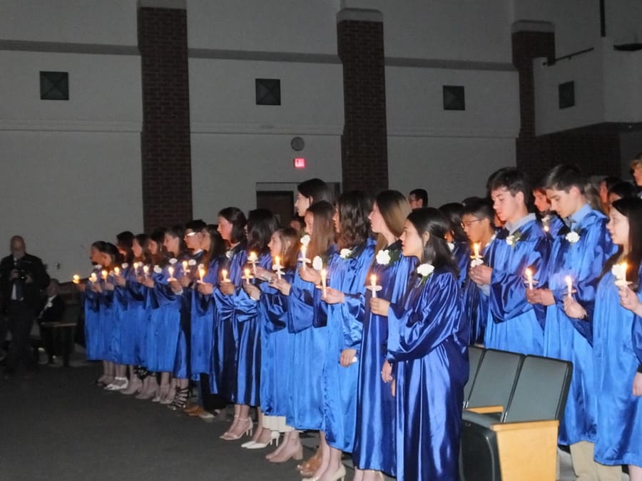 The blue robes are on, which means it's National Honor Society induction. Class of 2019.